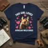 This Girl Loves African Wild Dogs t-shirt with a portrait of an African Wild Dog surrounded by hearts