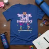 This Girl Loves Gymnastics text with two gymnasts on a balance beam, colorful hearts and stars graphic on a blue