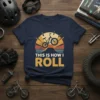 This Is How I Roll quote with a BMX bike against a retro sunset graphic on a navy t-shirt