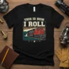 This Is How I Roll graphic tee with a vintage train design and colorful striped background