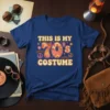 This Is My 70's Costume text in groovy font with 70s graphics on a blue t-shirt