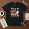 Black t-shirt with "This is my BOBA TEA drinking shirt" text and cute boba cup graphic