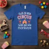 This is my CIRCUS These are my monkeys text design with circus tent and monkeys graphic on a blue t-shirt
