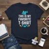 Navy t-shirt with white text "THIS IS MY FAVORITE T-SHIRT" and cartoon shirt graphic