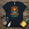 Retro design with text "THIS IS MY HAWAIIAN SHIRT" featuring a sunset, palm trees, and ocean waves