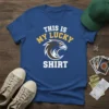 Blue t-shirt with white text "THIS IS MY LUCKY SHIRT" and a yellow eagle graphic, designed for sports fans
