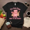 Cute pig wearing a scarf holding shopping bags with text "This Little Piggy Went To The Market"
