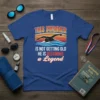 This swimmer is not getting old he is becoming a legend quote with a swimmer graphic on a blue t-shirt