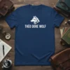 Théo Dore Wolf text with a stylized white wolf head graphic on a navy blue t-shirt