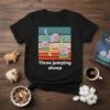 Three jumping sheep t-shirt design with cartoon sheep jumping over crescent moons against a striped background and stars