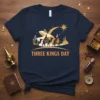 Three Kings Day t-shirt design showing three Wise Men riding camels towards a star, with city skyline and crescent moon