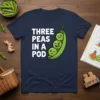 Three Peas In A Pod text and graphic on a navy blue t-shirt, featuring three cute peas inside a pod