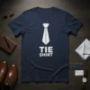 Navy blue t-shirt with a white graphic of a tie and the text "TIE SHIRT" below it