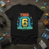 Tier 6 Unlocked graphic t-shirt design with a blue castle gate, yellow number 6, and a cute robot character