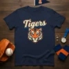Navy t-shirt featuring the word "Tigers" in retro script above a fierce tiger mascot head graphic