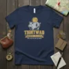 Navy T-shirt with a piggy bank graphic and "TIGHTWAD MISSOURI USA 64735" text, including coordinates 38° 18' 35" N, 93°