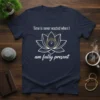 Navy t-shirt with white text "Time is never wasted when I am fully present" and a lotus flower graphic with
