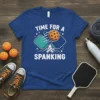Blue t-shirt with "TIME FOR A SPANKING" text, pickleball paddles, and ball graphic