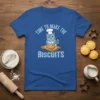 Blue t-shirt with cartoon cat chef wearing a hat and apron, making biscuits, text "Time to Make the Biscuits"