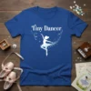 Blue t-shirt with "Tiny Dancer" text and a silhouette of a ballerina mid-leap, surrounded by sparkling stars