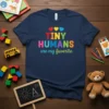 Tiny Humans Are My Favorite text with colorful hearts and typography on a navy blue t-shirt