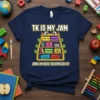 Navy t-shirt with "TK IS MY JAM" and a bookshelf graphic labeled with "Circle Time," "Phonics Fun," "Big Feelings," "Snack