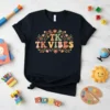TK VIBES text in colorful retro font surrounded by floral elements on a black t-shirt