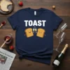 TOAST t-shirt design with two smiling toast characters holding champagne glasses and the word TOAST in bold white letters