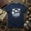 Tobruk Africa Expedition بونج text with lion, palm trees, and sunset graphic on a navy t-shirt