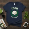 Navy t-shirt with "TOFU PLANT POWER" text and a graphic of a tofu block surrounded by a laurel wreath