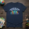 Navy t-shirt with "TOGETHER WE STAND IN SOLIDARITY" text above colorful city skyline and silhouetted figures holding hands