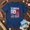 Tonga flag whale tail design on a blue t-shirt, featuring Polynesian patterns and ocean waves