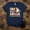 Navy blue t-shirt with "TOO CUTE to SPOOK" text and a cute ghost holding a pumpkin, with pumpkins below
