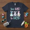 Too HIP to HOP text with three bunnies wearing sunglasses, headphones, and holding a skateboard on a navy t-shirt