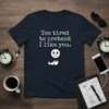 Navy t-shirt with white text "Too tired to pretend I like you" and a sad emoji holding coffee cup