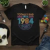 Totally Rad Since 1984 t-shirt with a retro boombox graphic and 80s-inspired neon stripes