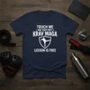 Navy blue t-shirt with white text: "TOUCH ME AND YOUR FIRST KRAV MAGA LESSON IS FREE" and a shield graphic