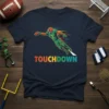 Football player in green and orange uniform making a touchdown dive, with "TOUCHDOWN" text below