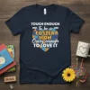 T-shirt with the quote "TOUGH ENOUGH to be a FOSTER MOM Crazy enough TO LOVE IT" in white and orange