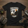 Tough Mudder Legend t-shirt design featuring silhouettes of athletes conquering an obstacle course, with mud splatters and a sunset graphic