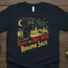 Tournee du Chat Noir Rodolphe Salis design on a dark t-shirt featuring a black cat, crescent moon, and Parisian cityscape