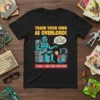 Black t-shirt with "Train Your Own AI Overlord Lesson Beep Boop Bow Down" text and cartoon of a robot and
