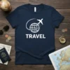 Navy t-shirt with white TRAVEL text and a globe with airplane graphic, symbolizing world travel