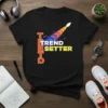 Black t-shirt with "TREND SETTER" text in white and yellow, featuring a colorful arrow graphic streak
