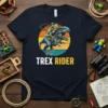 TREX RIDER t-shirt with a frog riding a T-Rex dinosaur and a retro sunset graphic