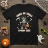Trick or Treat Spooky Dude Halloween t-shirt with a cartoon skeleton holding a scythe and candy bucket