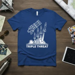Triple Threat t-shirt with a white outline design of a multi-barrel weapon and three rockets launching from a platform