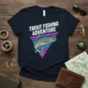 Trout Fishing Adventure text above a colorful trout graphic within a retro triangle design on a navy t-shirt