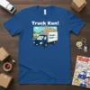 Truck Kun! トラックくん anime t-shirt with a cute blue delivery truck and Japanese text, featuring a cityscape background