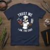Trust Me I Am, The Chef text with a badger chef holding a sausage and cleaver on a navy t-shirt